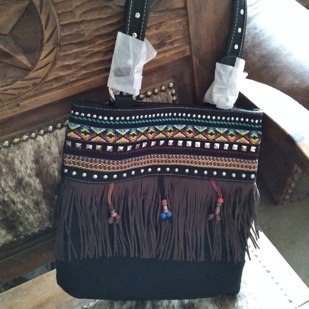 Montana West conceal carry fringed shoulder bag.